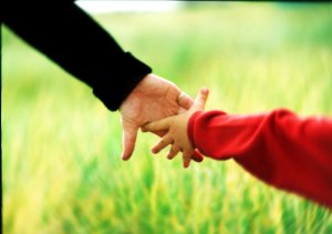 adult child hold hands